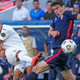 Honduras’ Edwin Rodríguez shoots past Gio Reyna during CONCACAF Nations League semi.